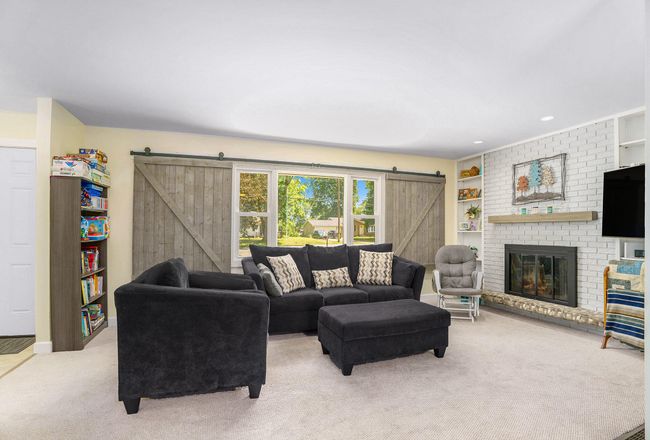 LIVING ROOM - FIREPLACE - SLIDING BARN DOOR STYLE WINDOW COVERING | Image 5