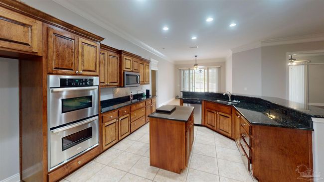 7445 Brevard St, House other with 4 bedrooms, 3 bathrooms and 6 parking in Navarre FL | Image 7