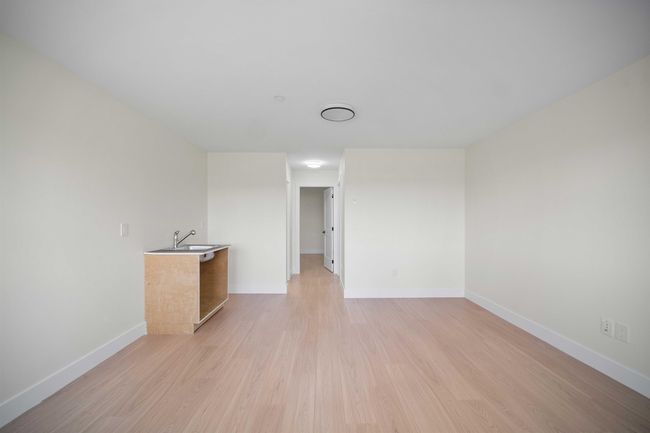 Spare room featuring light wood-type flooring and baseboards | Image 20