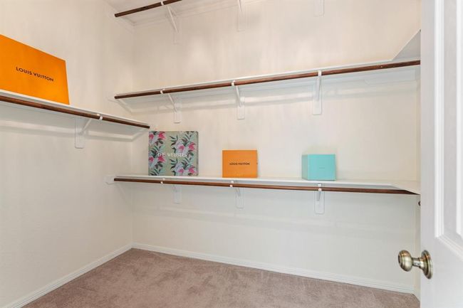 One of two walk-in closets in the primary suite. | Image 20