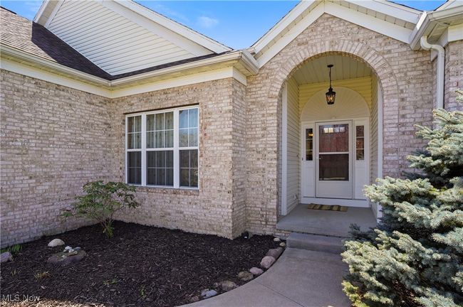 Doorway to property featuring brick siding | Image 8