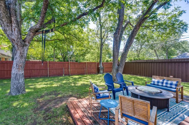 Wooden deck featuring a fire pit | Image 21