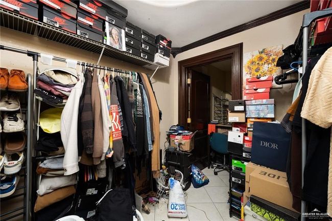 Walk in closet with light tile patterned floors | Image 16