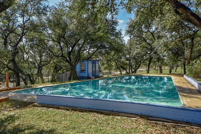 View of pool featuring fence, an outdoor structure, and a fenced in pool | Image 28