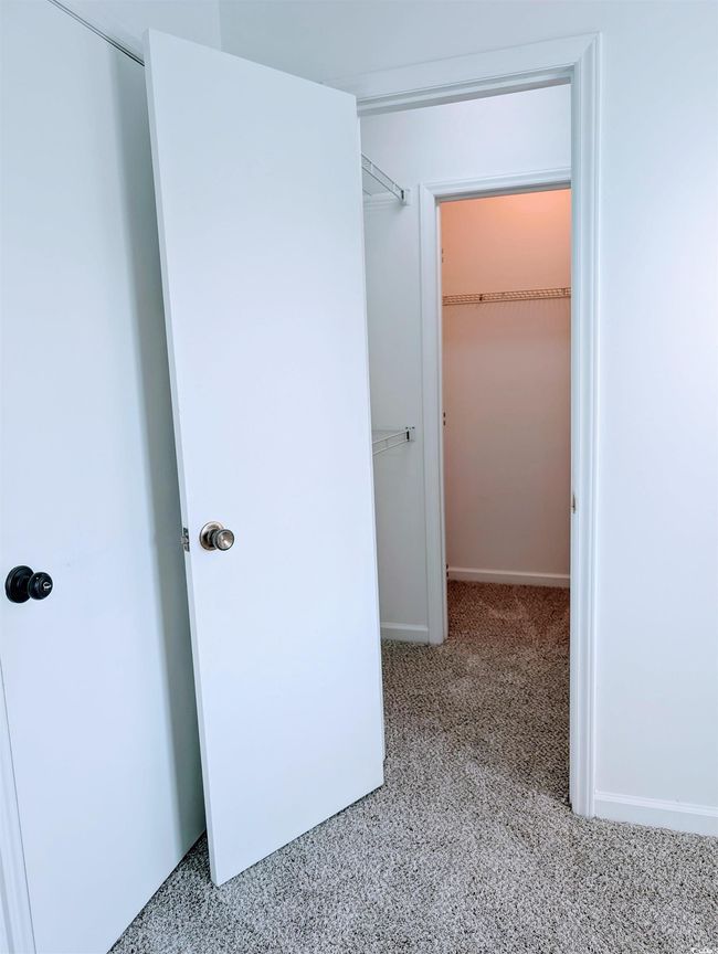 Hallway with carpet floors | Image 11