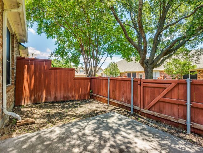 View of patio with a gate | Image 24