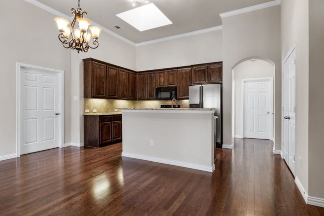 Skylight in kitchen welcomes more natural light into this sought after floor plan. | Image 14