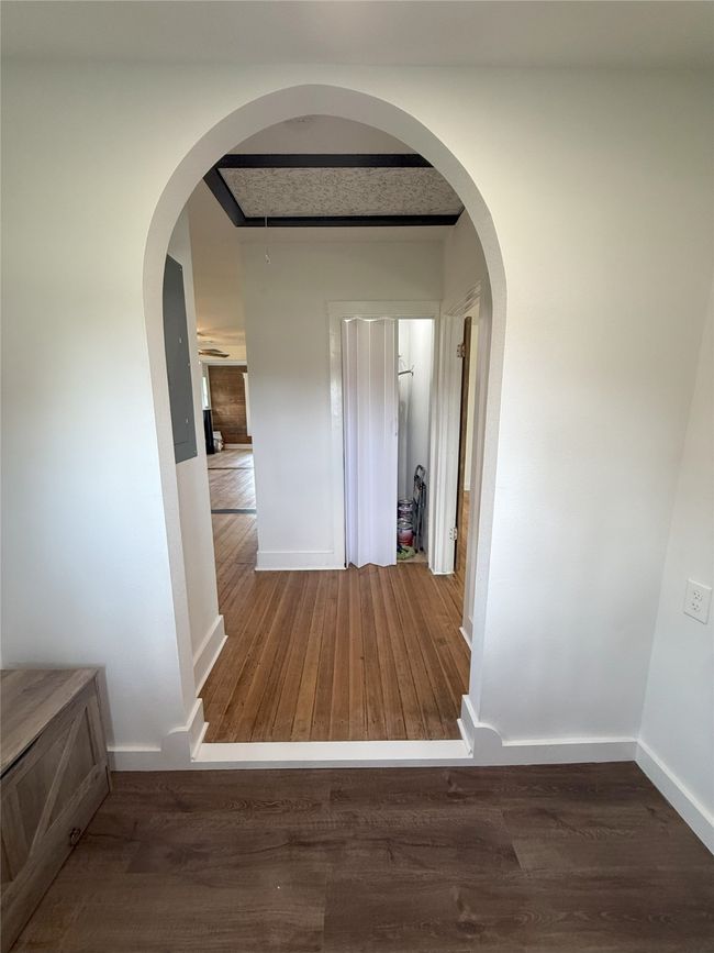 Hall with wood finished floors and baseboards | Image 15