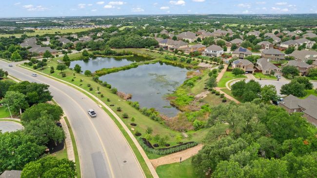 Aerial perspective of suburban area featuring a nearby body of water | Image 38