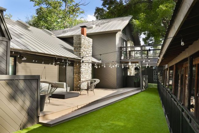 View of yard featuring a balcony and fence | Image 31