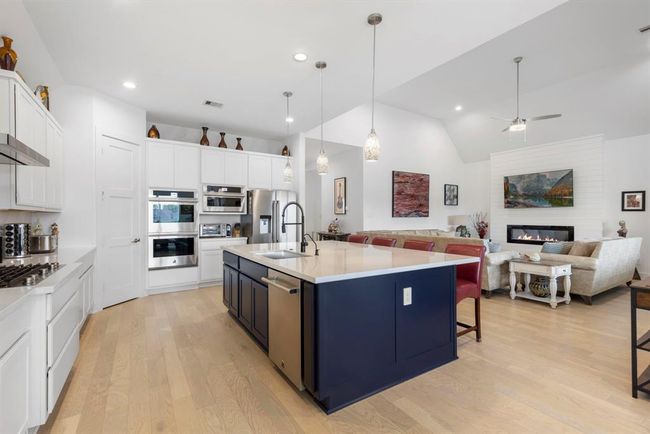 Upgraded kitchen with a sleek JennAir stainless steel hood and appliance package, blending style and functionality seamlessly. | Image 20