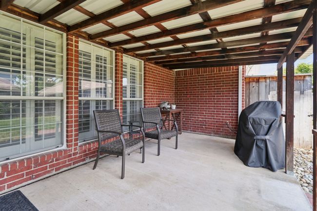 View of patio featuring area for grilling | Image 34