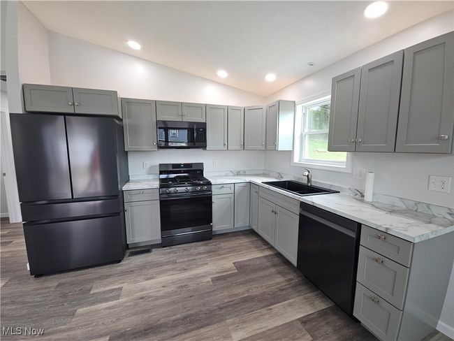 Gorgeous Matte Black appliance package and soft close cabinetry, all LED lights | Image 8