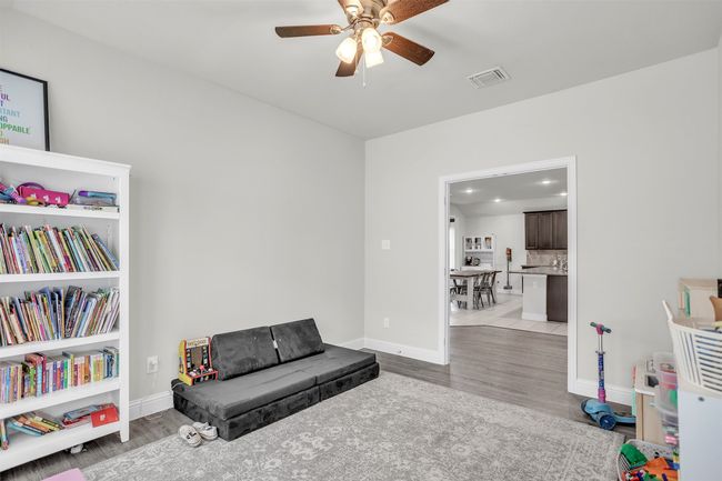 Sitting room with wood finished floors, a ceiling fan, and recessed lighting | Image 21