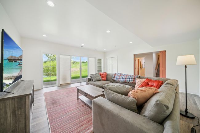 The walkout lower level provides a fantastic space perfect for entertaining guests or unwinding in comfort. | Image 34