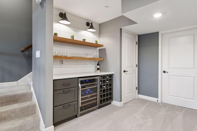 2nd lower level beverage fridge. Storage under the stairs + access to the mechanical room providing a surprising amount of additional storage. | Image 35