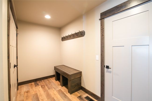 Kitchen featuring separate washer and dryer, sink, and light wood-type flooring | Image 25