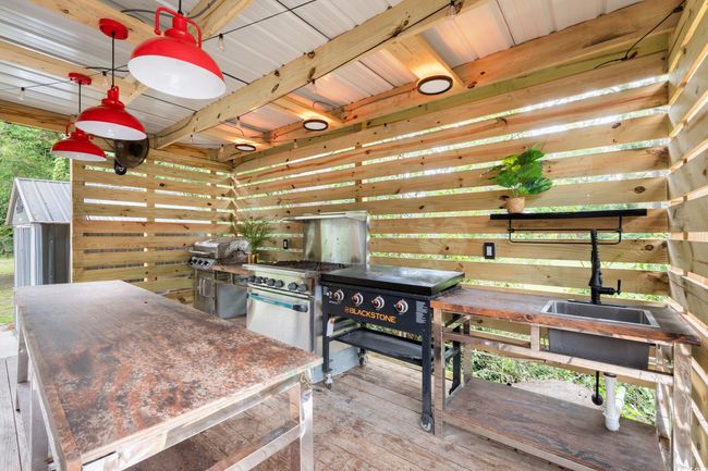 Kitchen with hardwood / wood-style flooring and wooden walls | Image 31