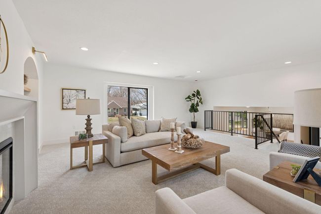 Living area is open to the kitchen/dining areas but still has enough separation for some privacy. | Image 14