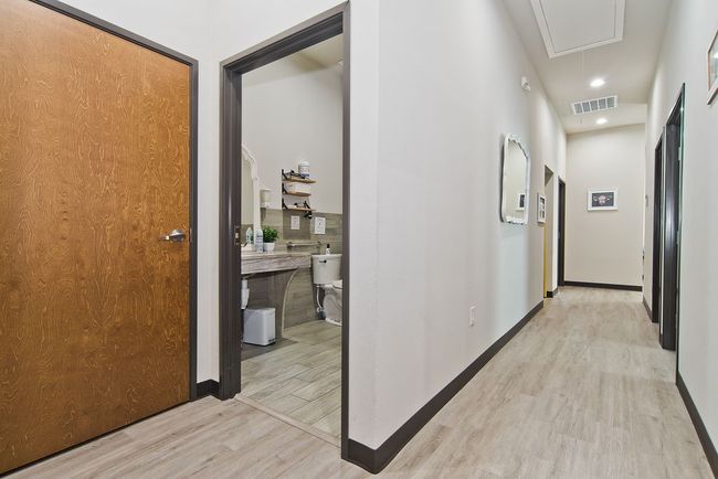 Hallway featuring attic access, light wood-style floors, and recessed lighting | Image 11