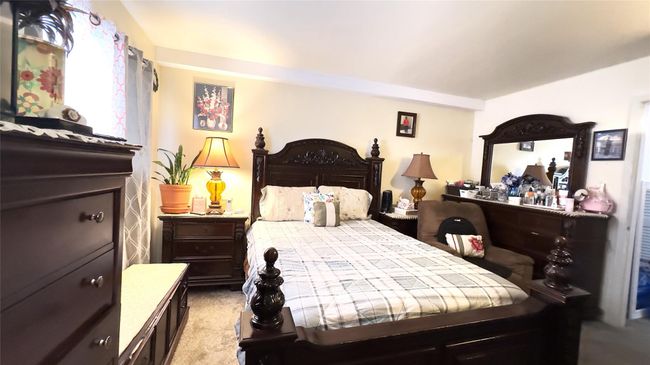 Bedroom with light colored carpet | Image 8