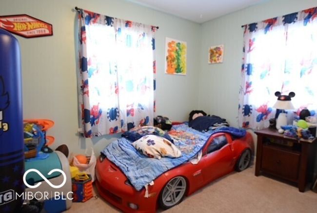 view of carpeted bedroom | Image 18