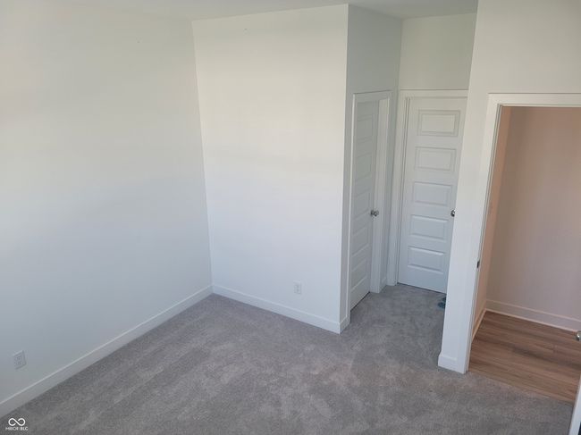unfurnished bedroom featuring carpet and baseboards | Image 13