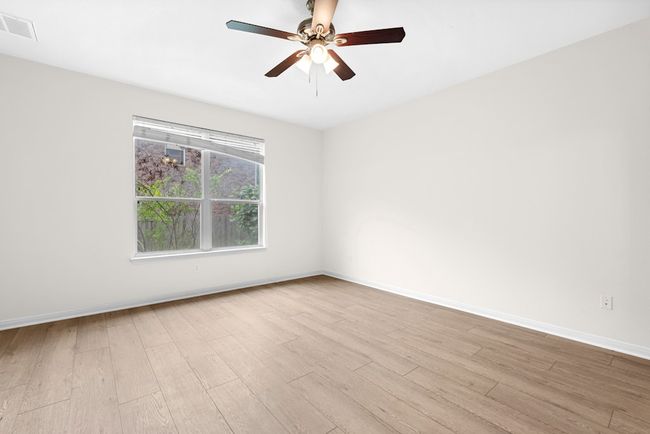 Spare room featuring wood finished floors and a ceiling fan | Image 28