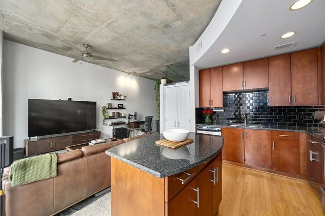 Kitchen with a sink, decorative backsplash, a ceiling fan, a center island, and recessed lighting | Image 9