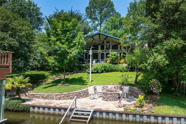 Firepit by water. Propane starter. Vegetable Garden runs beside firepit | Image 37