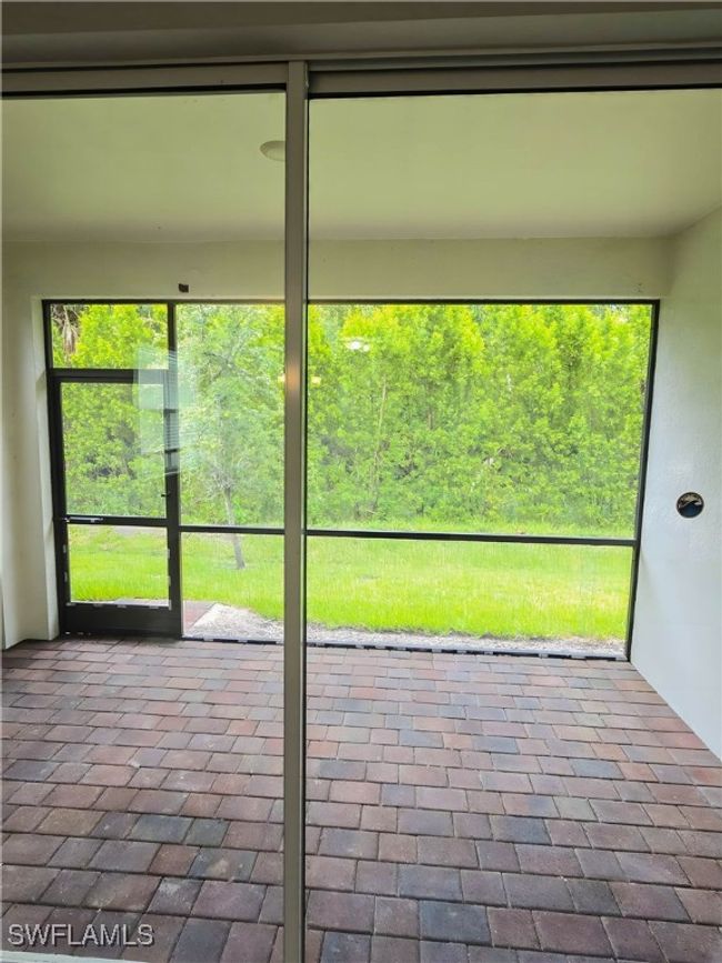 View of unfurnished sunroom | Image 17