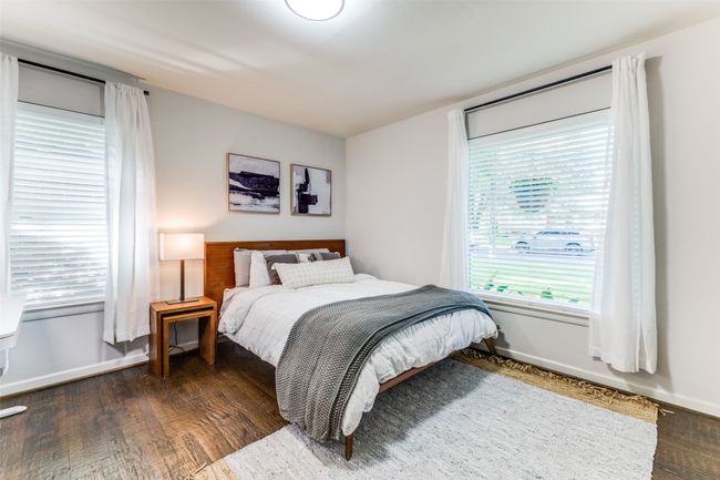 Bedroom with wood finished floors and baseboards | Image 14