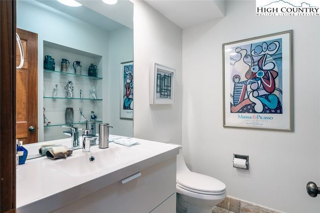 Main level living half bathroom. | Image 28
