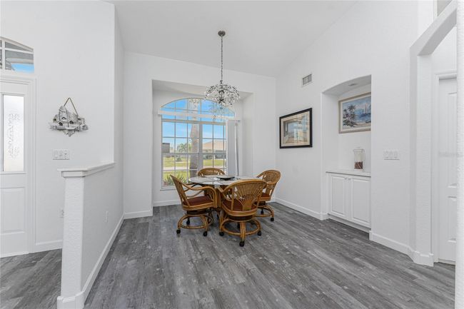 Dining room has a beautiful front window | Image 11