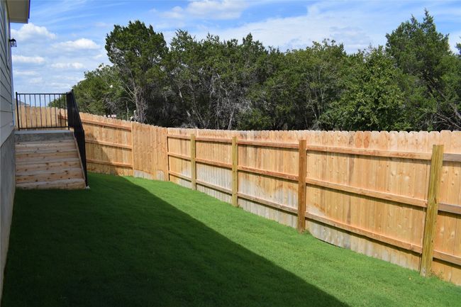 View of fenced backyard | Image 23