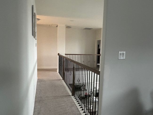 Corridor with visible vents and carpet | Image 5