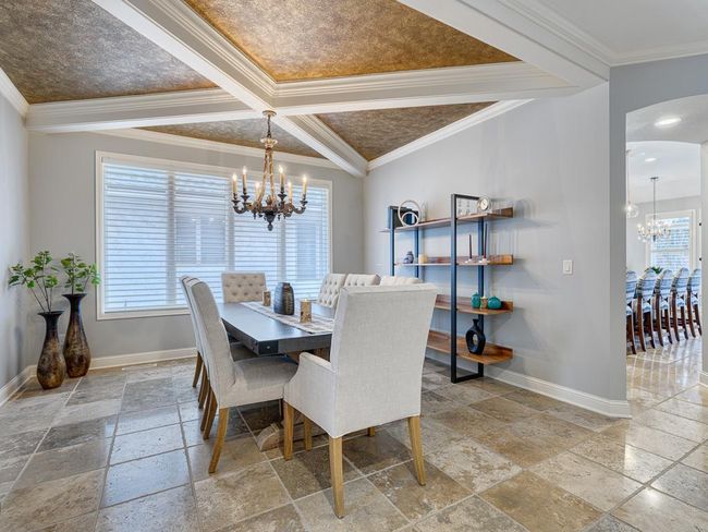 The custom tiled floors flow throughout. | Image 12
