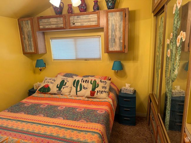 Bedroom with carpet and vaulted ceiling | Image 15