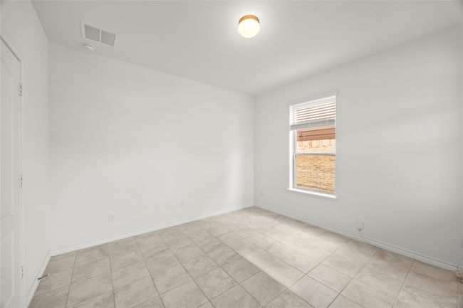 Empty room featuring baseboards and a smoke detector | Image 15
