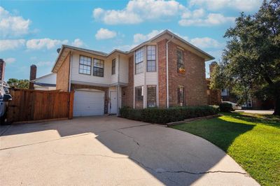 View of front facade featuring a garage and a front yard | Image 3