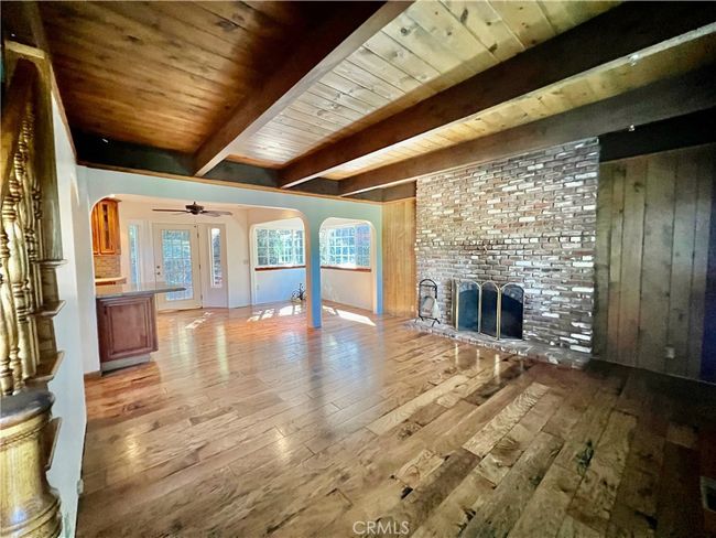 Living room with fireplace. | Image 17