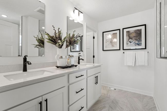 (Photo of a decorated model, actual homes finishes will vary) The primary bath includes a double-vanity and a serenity shower. | Image 14