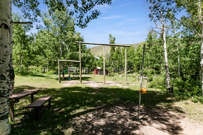 View of playground with a storage shed, a lawn, and a mountain view | Image 27