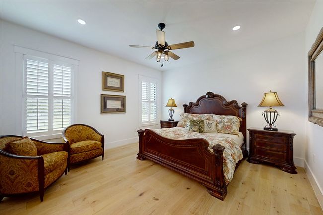 Bedroom featuring baseboards, light wood-style flooring, recessed lighting, and ceiling fan | Image 23