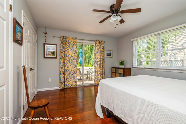 Downstairs Bedroom has Sliding Door to outside Deck | Image 14