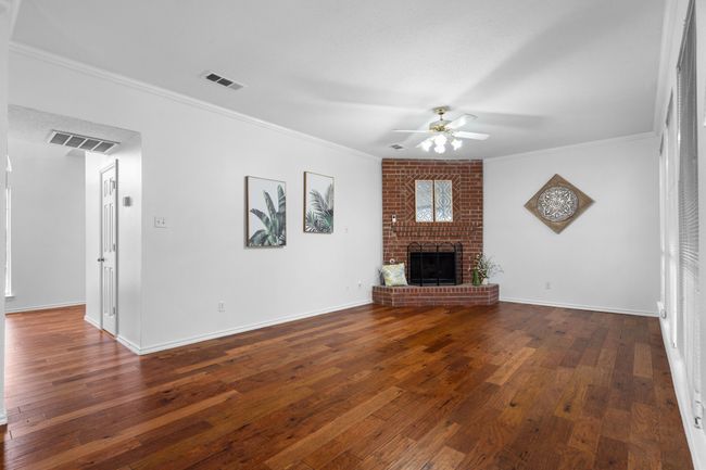 The family room has crown molding and overlooks the back yard. | Image 10