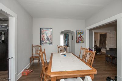 Dining space with dark wood-type flooring | Image 3