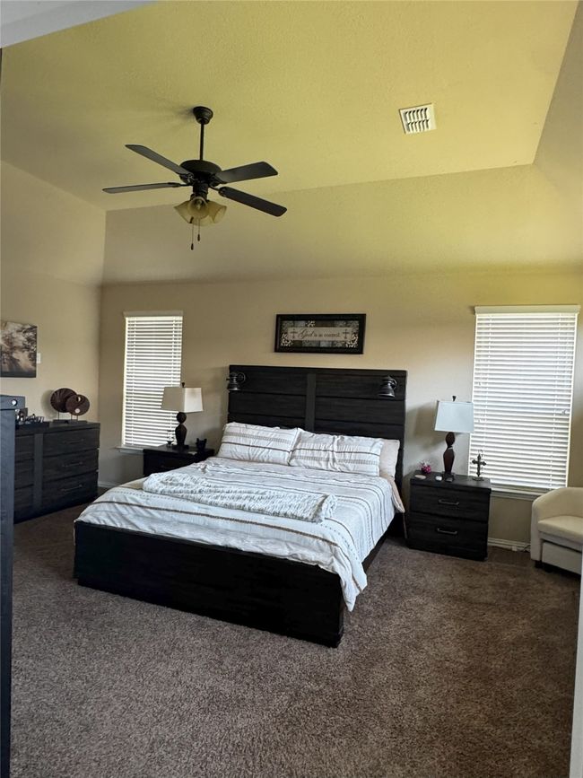 Master Bedroom featuring carpet flooring, vaulted ceiling, and a ceiling fan | Image 6