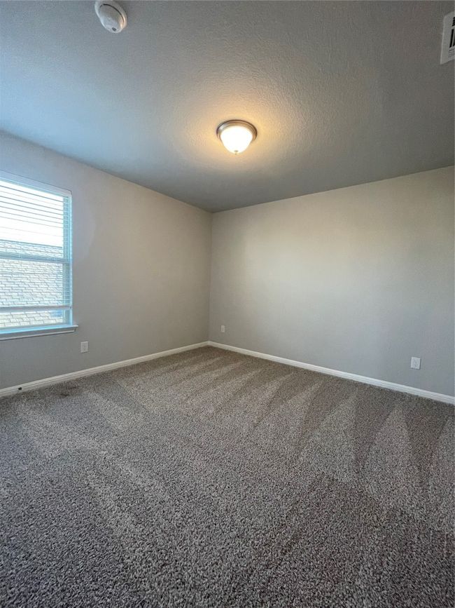 Unfurnished room with carpet flooring and a textured ceiling | Image 18