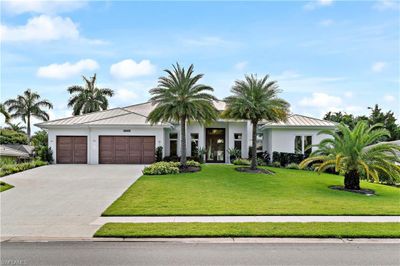 View of front of home featuring a garage and a front lawn | Image 1